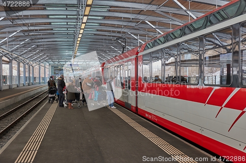 Image of Zermatt Shuttle train in the Swiss Alps arriving at station