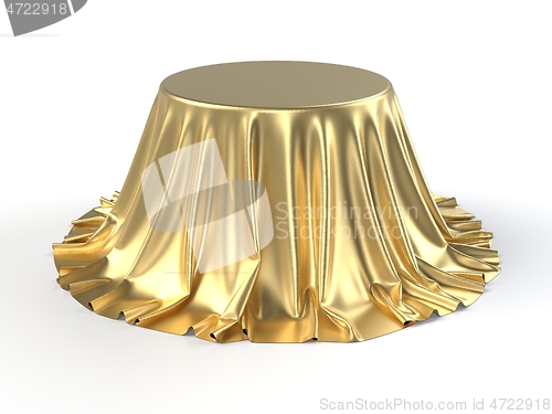 Image of Round box covered with golden fabric isolated on white background