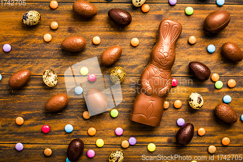 Image of Chocolate Easter bunny with sweet chocolate eggs and colorful sweets