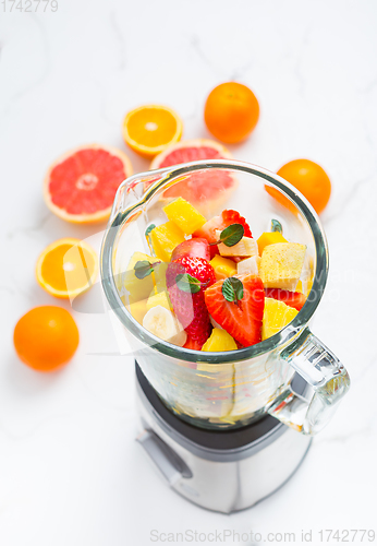 Image of Variation of fruits in mixer. Preparing milkshake or smoothie