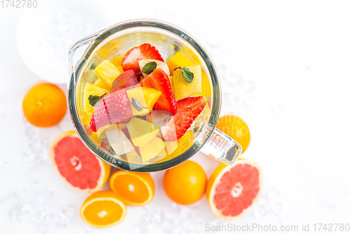 Image of Variation of fruits in mixer. Preparing milkshake or smoothie