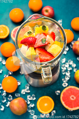 Image of Variation of fruits in mixer. Preparing milkshake or smoothie