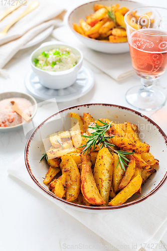 Image of Homemade baked potato wedges with garlic dip