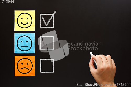 Image of Happy Client Filling Out Feedback Survey