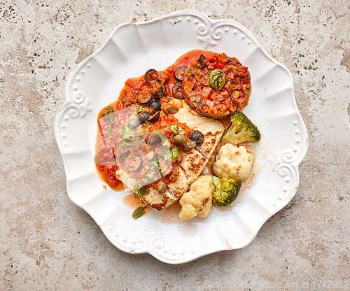 Image of portion of cod fish with vegetables