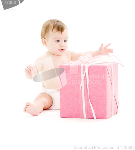 Image of baby boy in diaper with big gift box