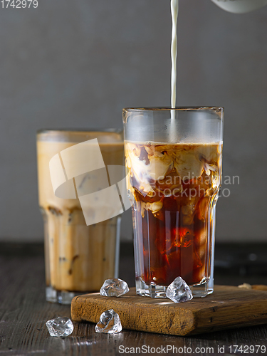 Image of two glasses of iced coffee with milk