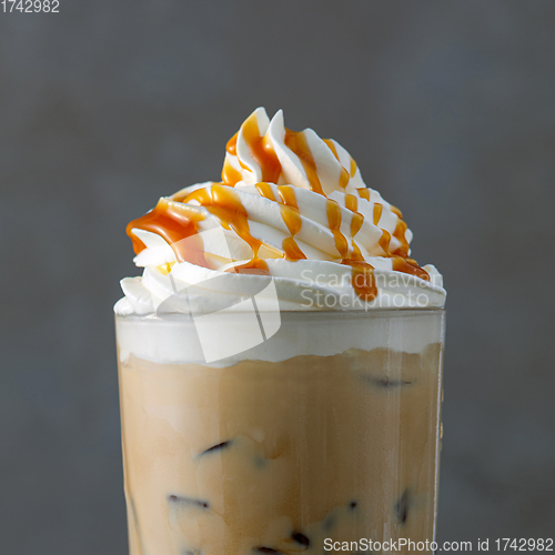 Image of iced coffee latte with whipped cream and caramel sauce