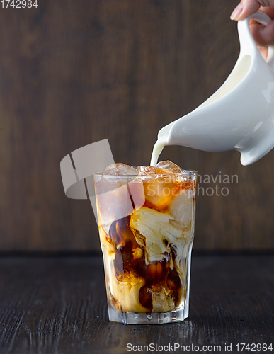 Image of glass of iced coffee with milk