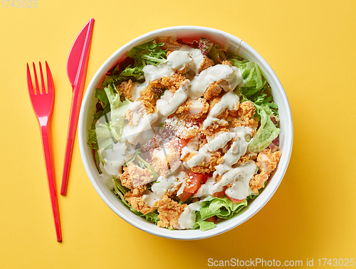 Image of caesar salad with fried chicken meat