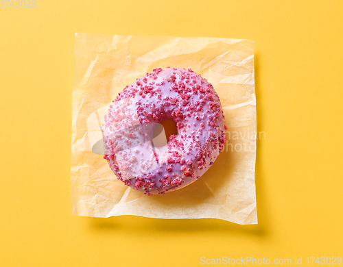 Image of pink donut on yellow background