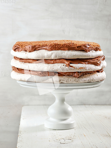 Image of homemade meringue and nut cake with chocolate cream