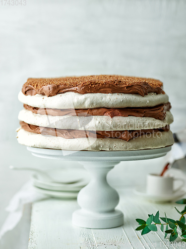 Image of homemade meringue and nut cake with chocolate cream