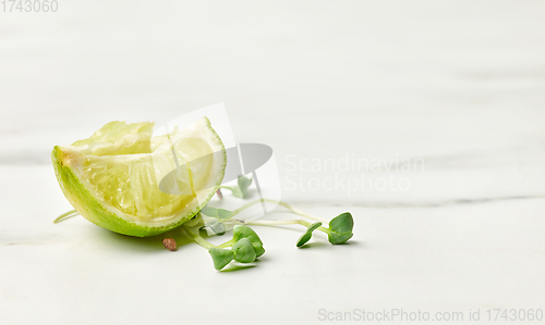 Image of fresh greens and squeezed lime slice