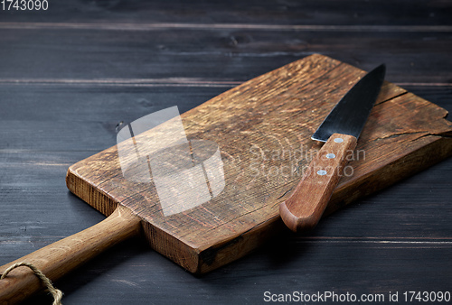 Image of empty wooden cutting board and knife