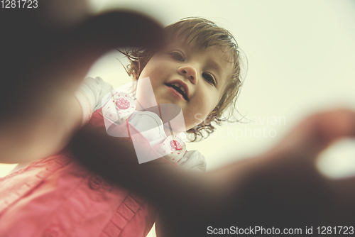 Image of little girl spending time at backyard