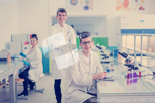 Image of Group of young medical students doing research