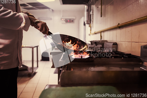 Image of Chef doing flambe on food