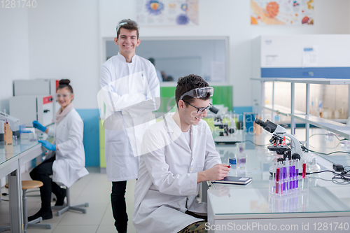 Image of Group of young medical students doing research