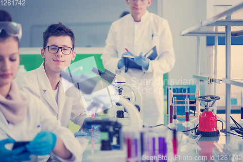 Image of Group of young medical students doing research