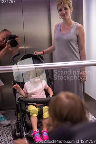 Image of happy family in the elevator