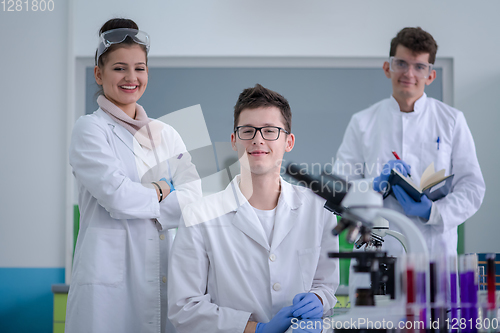 Image of Group of young medical students doing research