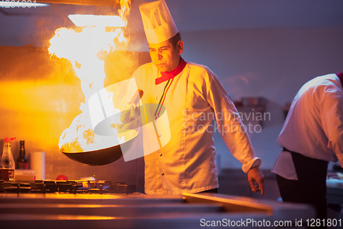 Image of Chef doing flambe on food