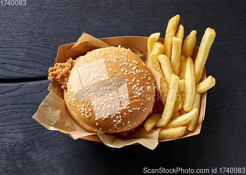 Image of fresh tasty burger and fried potatoes