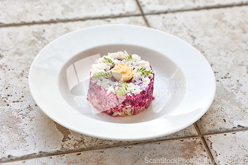 Image of portion of herring and beet salad