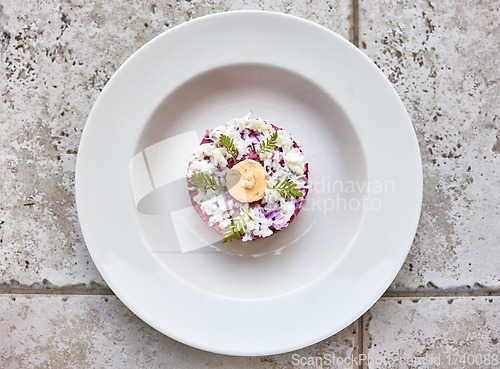 Image of portion of herring and beet salad