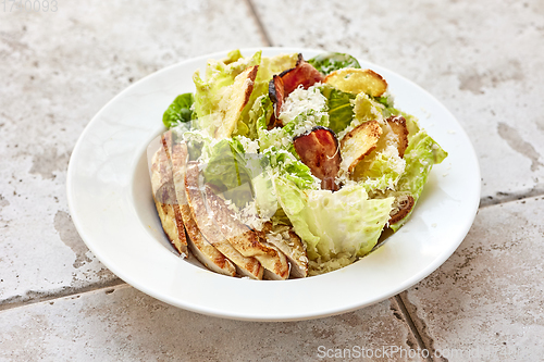 Image of portion of cesar salad with chicken