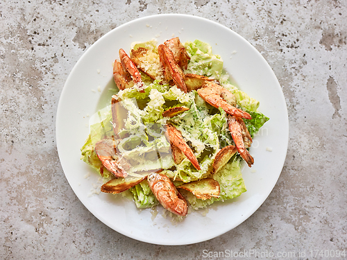 Image of portion of cesar salad with grilled prawns