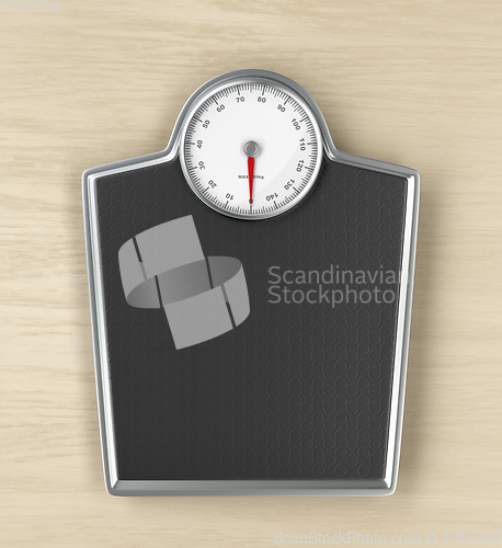 Image of Weighing scale on wooden floor