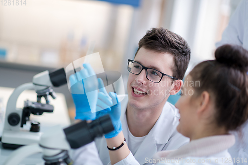 Image of Group of young medical students doing research