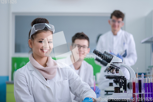 Image of Group of young medical students doing research