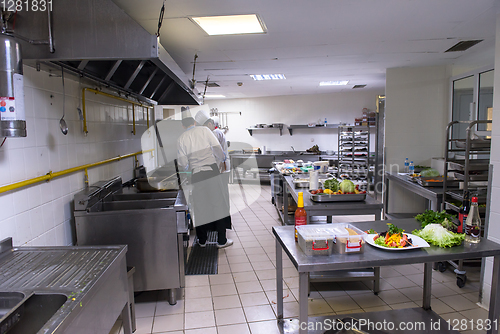 Image of team cooks and chefs preparing meals