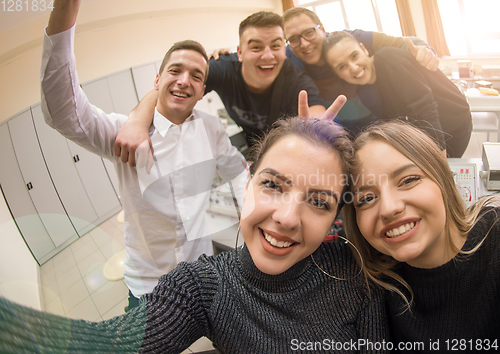 Image of young happy students doing selfie picture