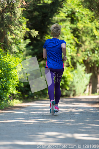 Image of young female runner training for marathon