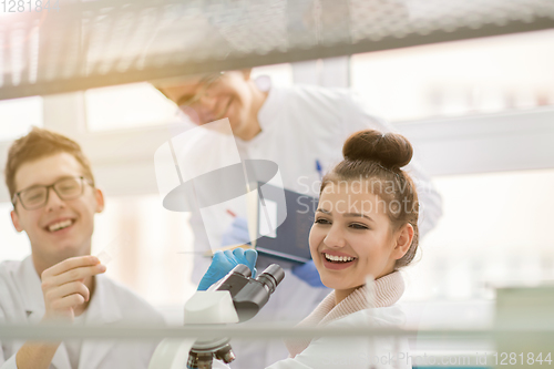 Image of Group of young medical students doing research