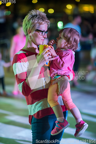 Image of mother and little daughter in the kids disco