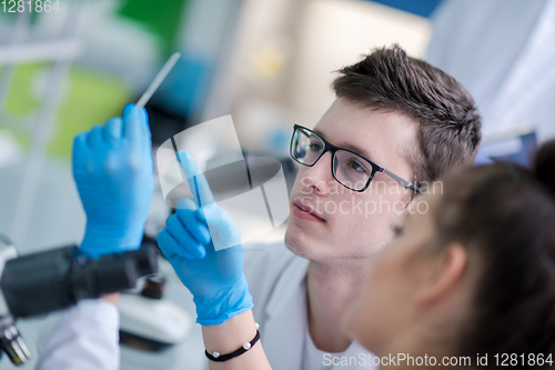 Image of Group of young medical students doing research