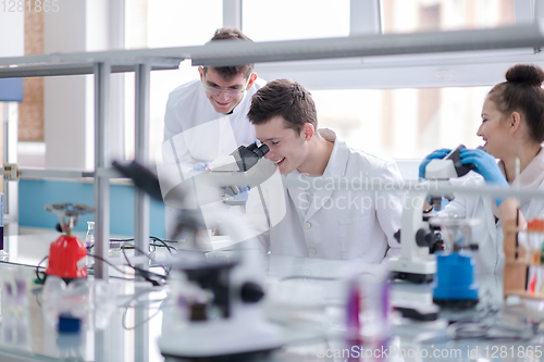Image of Group of young medical students doing research