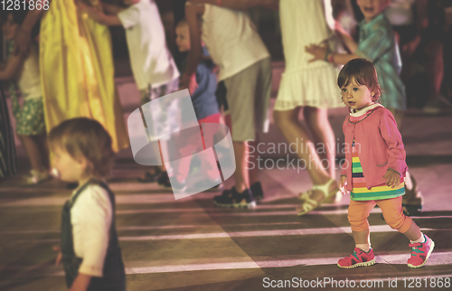 Image of little girl dancing in the kids disco