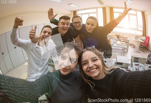 Image of young happy students doing selfie picture