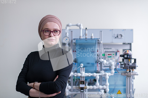 Image of portrait of muslim female student in the electronic classroom