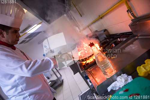 Image of Chef doing flambe on food