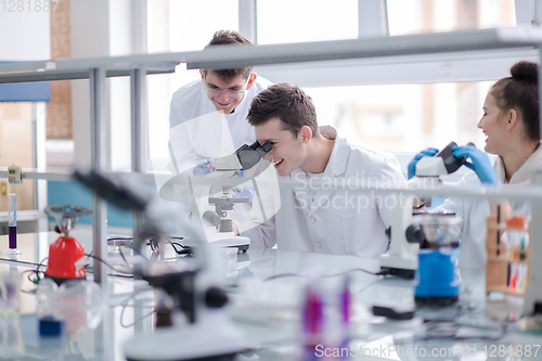 Image of Group of young medical students doing research