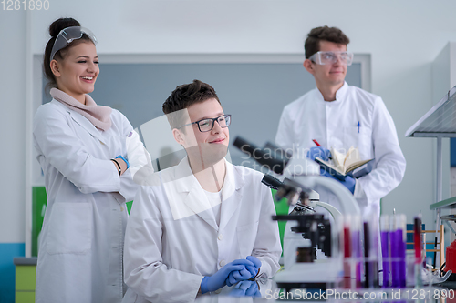 Image of Group of young medical students doing research