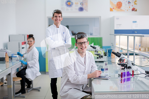 Image of Group of young medical students doing research