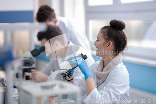 Image of Group of young medical students doing research